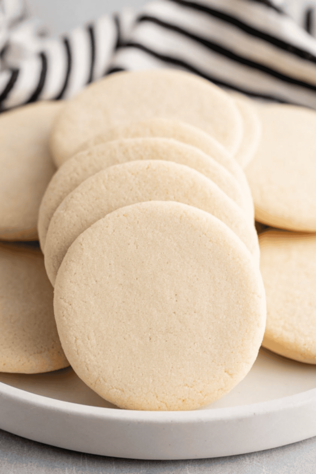 Buttery cookie dough balls on baking sheet for homemade cookies.