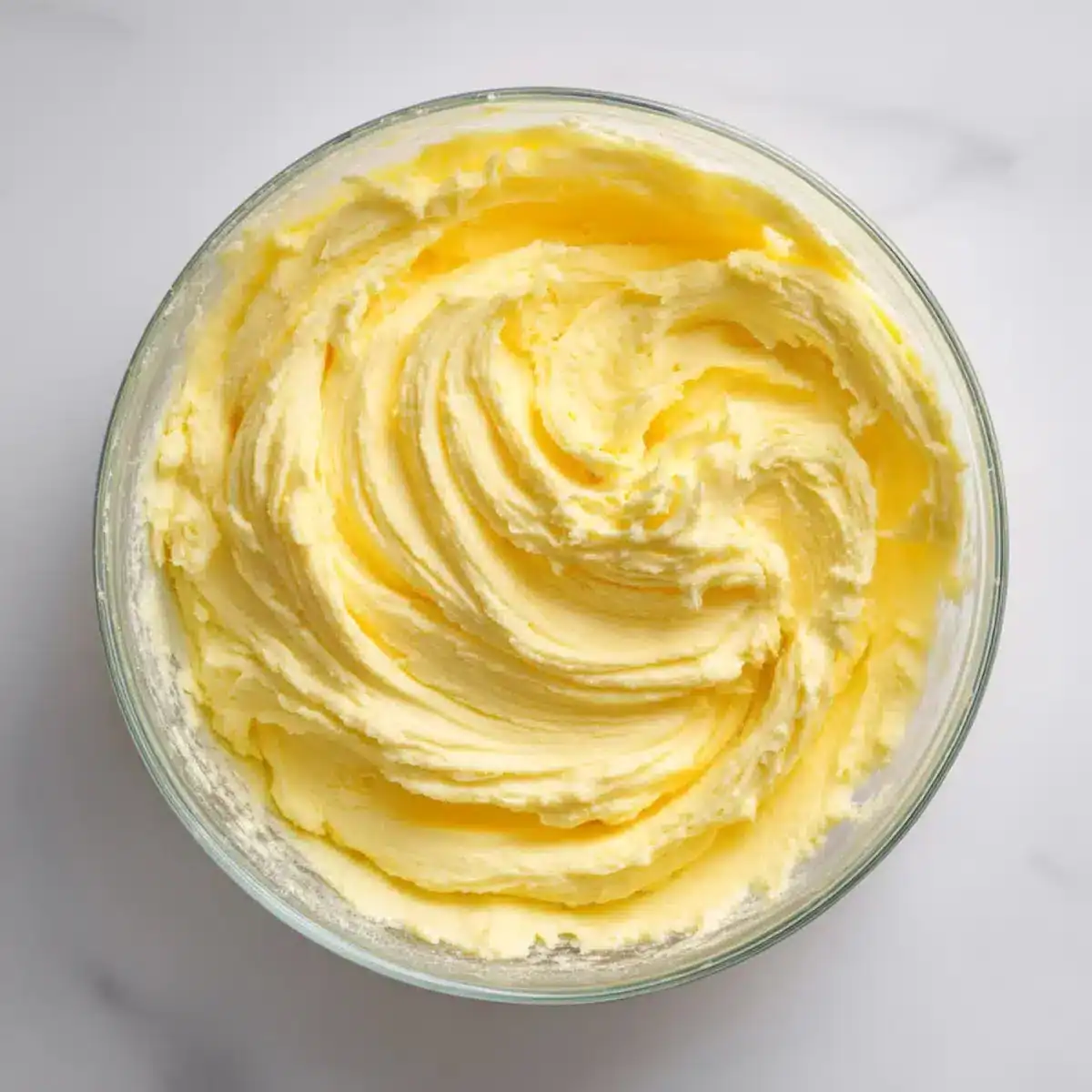 Creamy yellow frosting for baking, ideal for cookies and desserts.