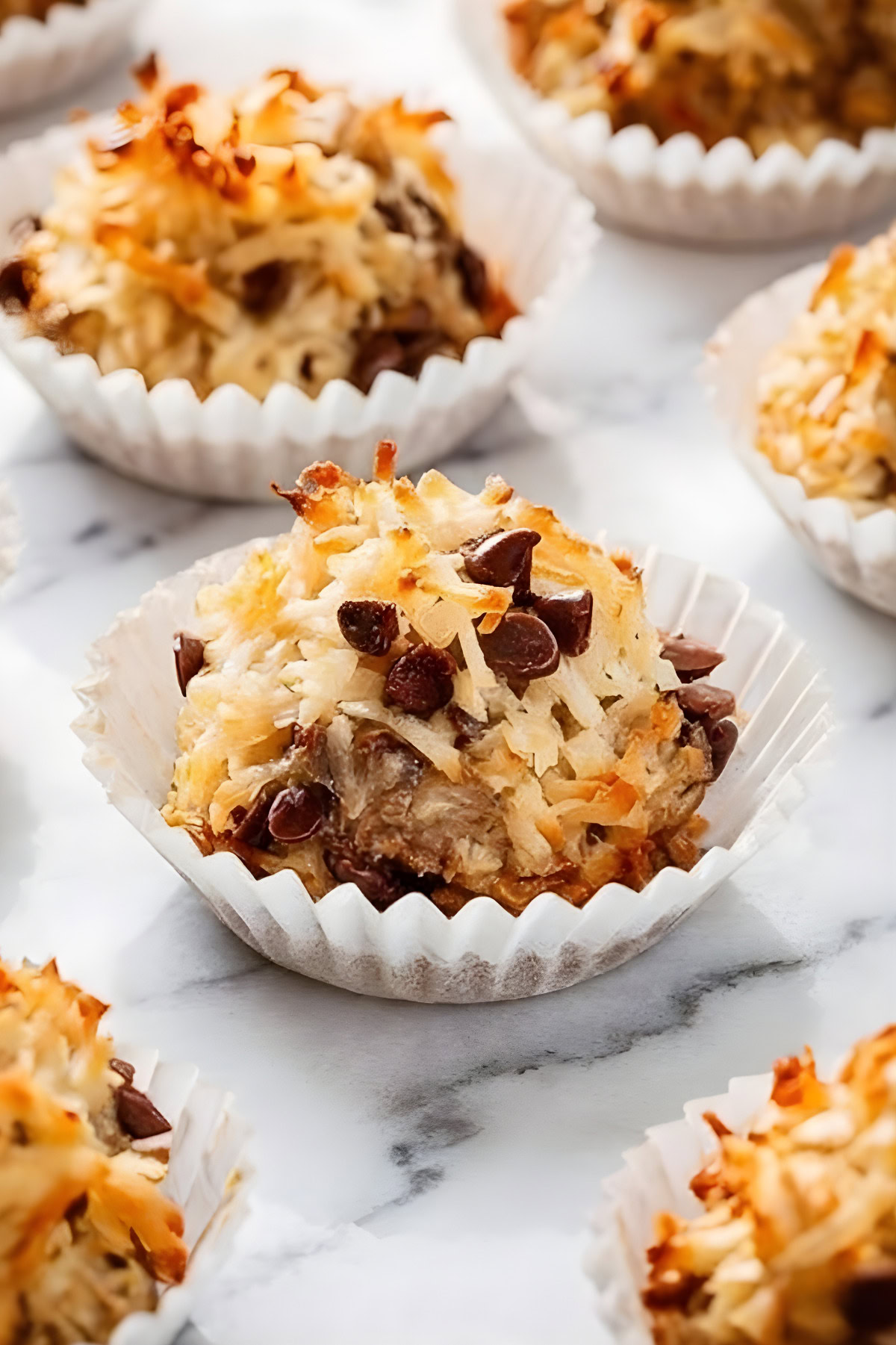 Delicious homemade coconut macaroons with chocolate chips, perfect for snack or dessert.