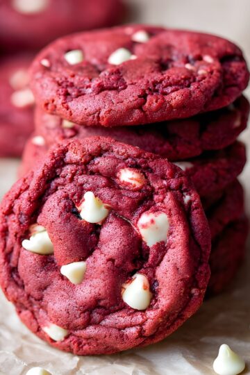 Delicious red cookies with white chocolate chips, perfect for dessert lovers and cookie recipes.