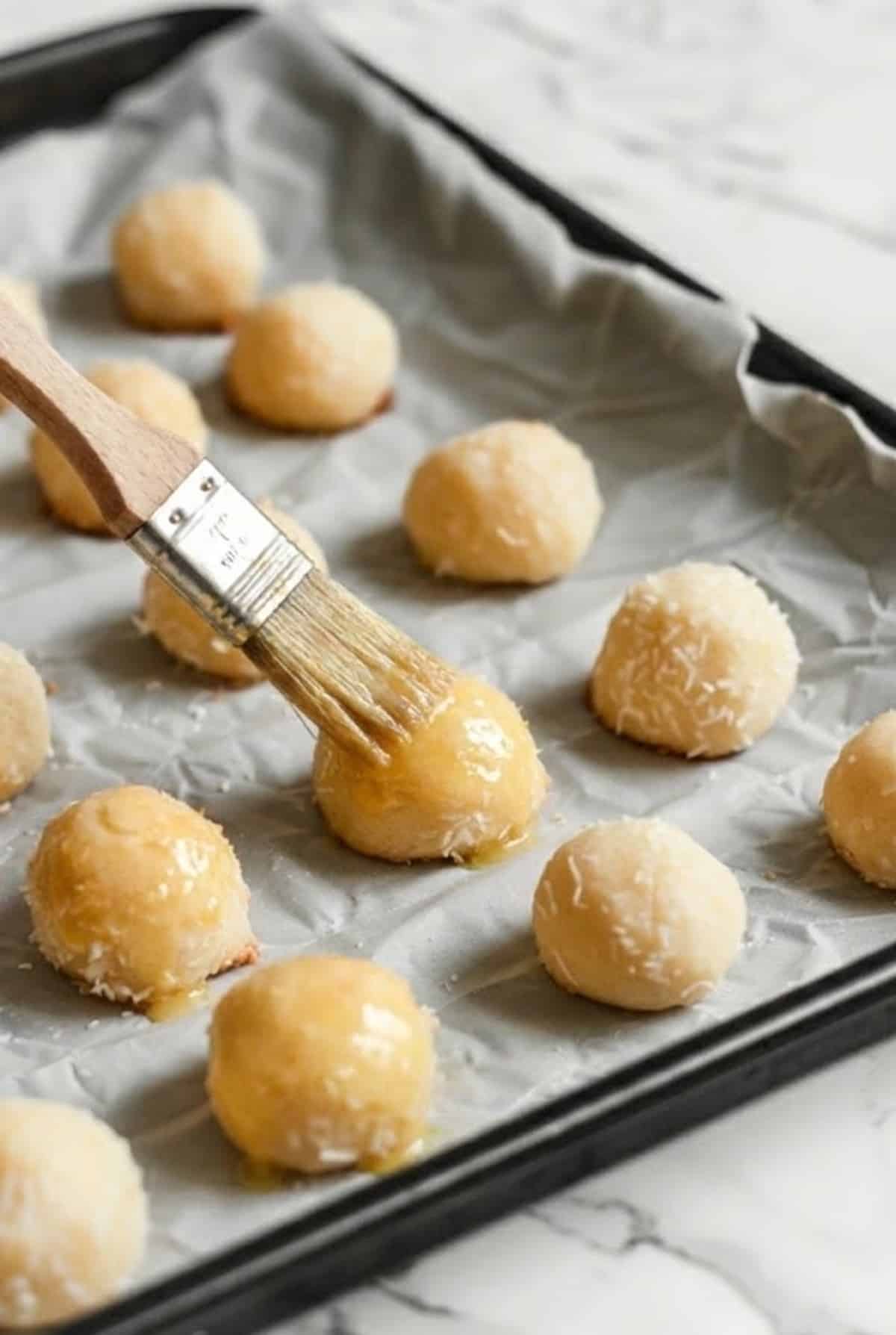 Delicious cookie dough balls ready to bake, perfect for homemade cookie recipes and treats.