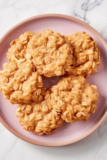 Peanut butter oatmeal cookies topped with drizzle, perfect for cookie lovers.