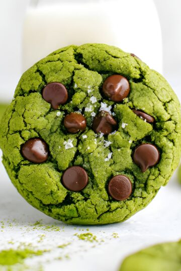 Vibrant green matcha cookies topped with chocolate chips, perfect for cookie lovers and dessert enthusiasts.